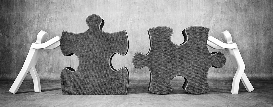 Uncontested Divorce - image of two stick figures pushing together interlocking puzzle pieces.